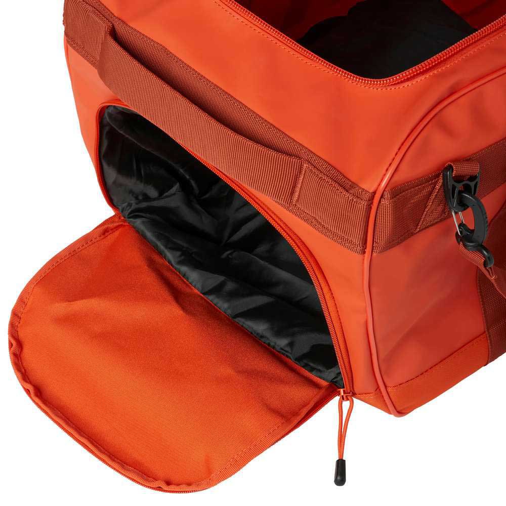 Купить Спортивная сумка Helly Hansen Scout Duffel L 67442_301-STD 680x320x320мм 70л 1300г цвет Patrol Orange 7ft.ru в интернет магазине Семь Футов